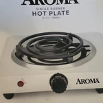 Aroma Single Burner Hot Plate 6IN 1000W Electric 120V White Metal AHP-303. Fixed Price $15.84.