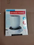 Brand New Merch Source Black White Electric Beverage Warmer. Fixed Price $24.99.